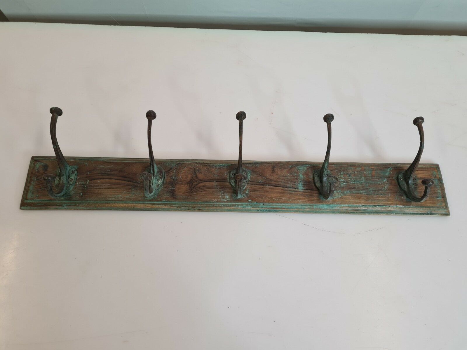 Wooden school coat rack with cast iron hooks