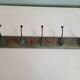 Wooden school coat rack with cast iron hooks