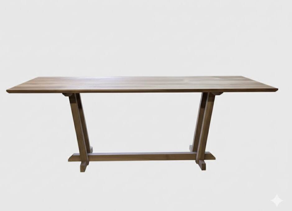 Exceptional dining table in solid walnut.