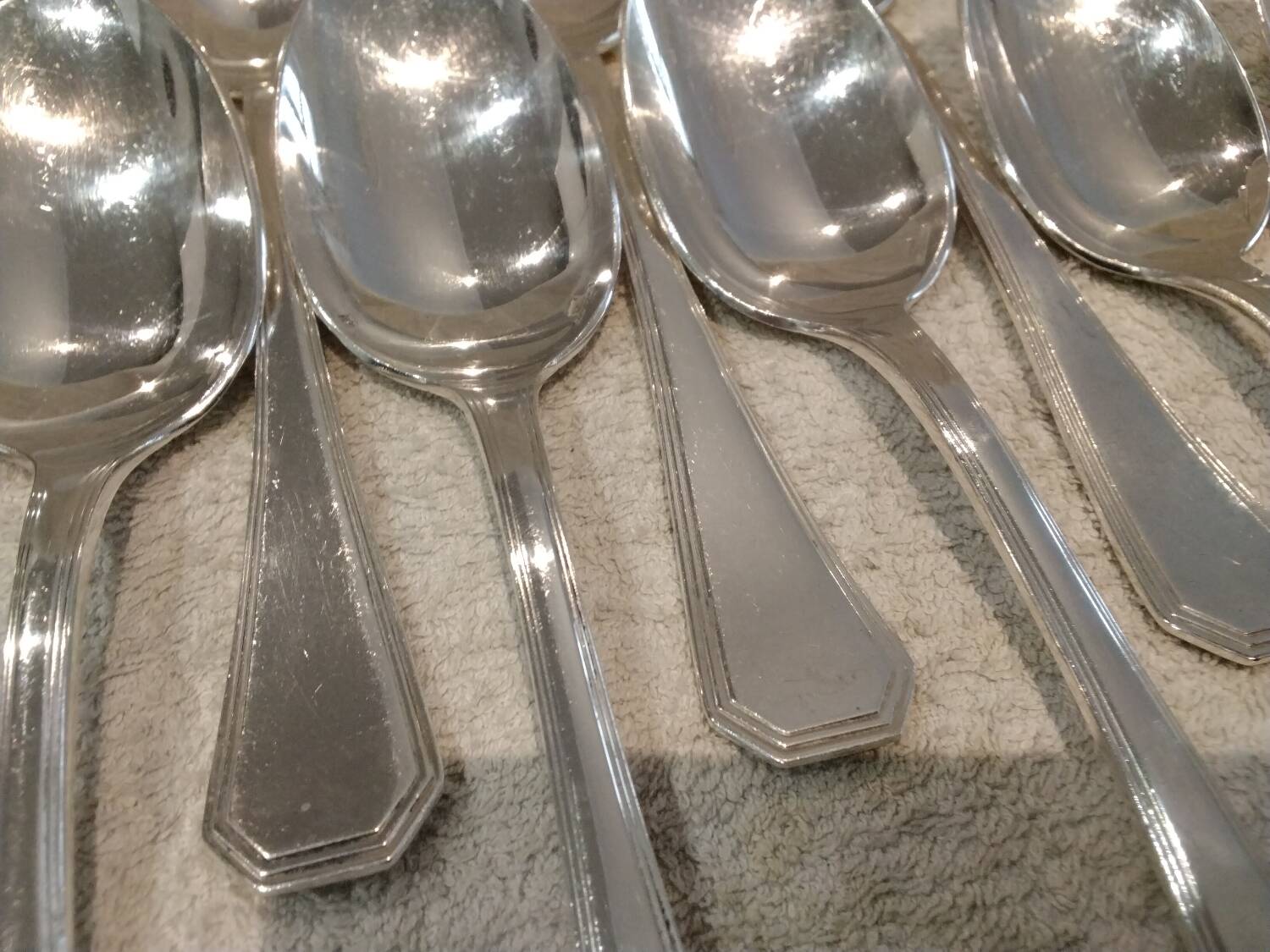 12 silver-plated soup spoons by Christofle America