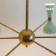 Contemporary 12-light diabolo-shaped radiant chandelier.
