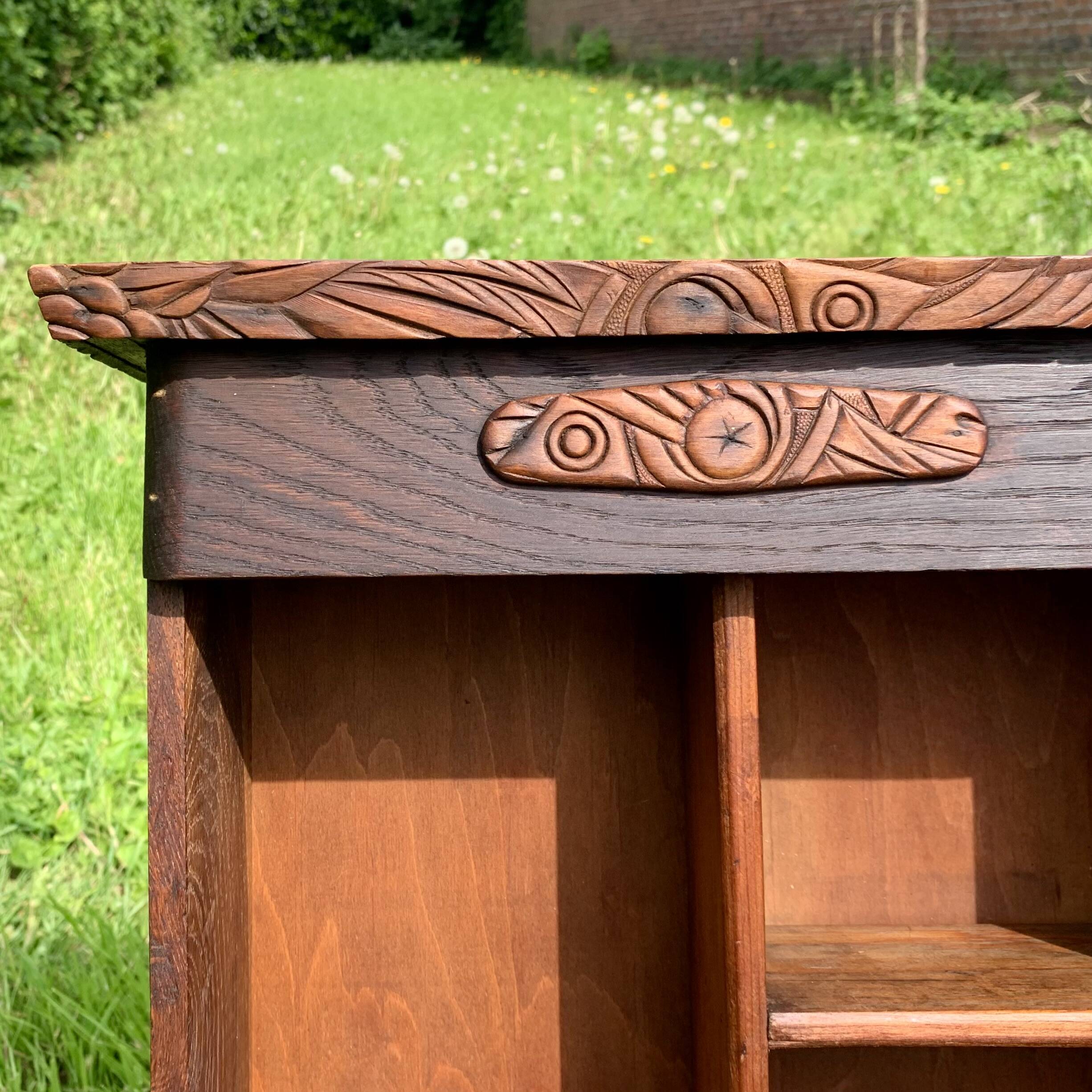 Old carved wooden medicine cabinet with beveled mirror