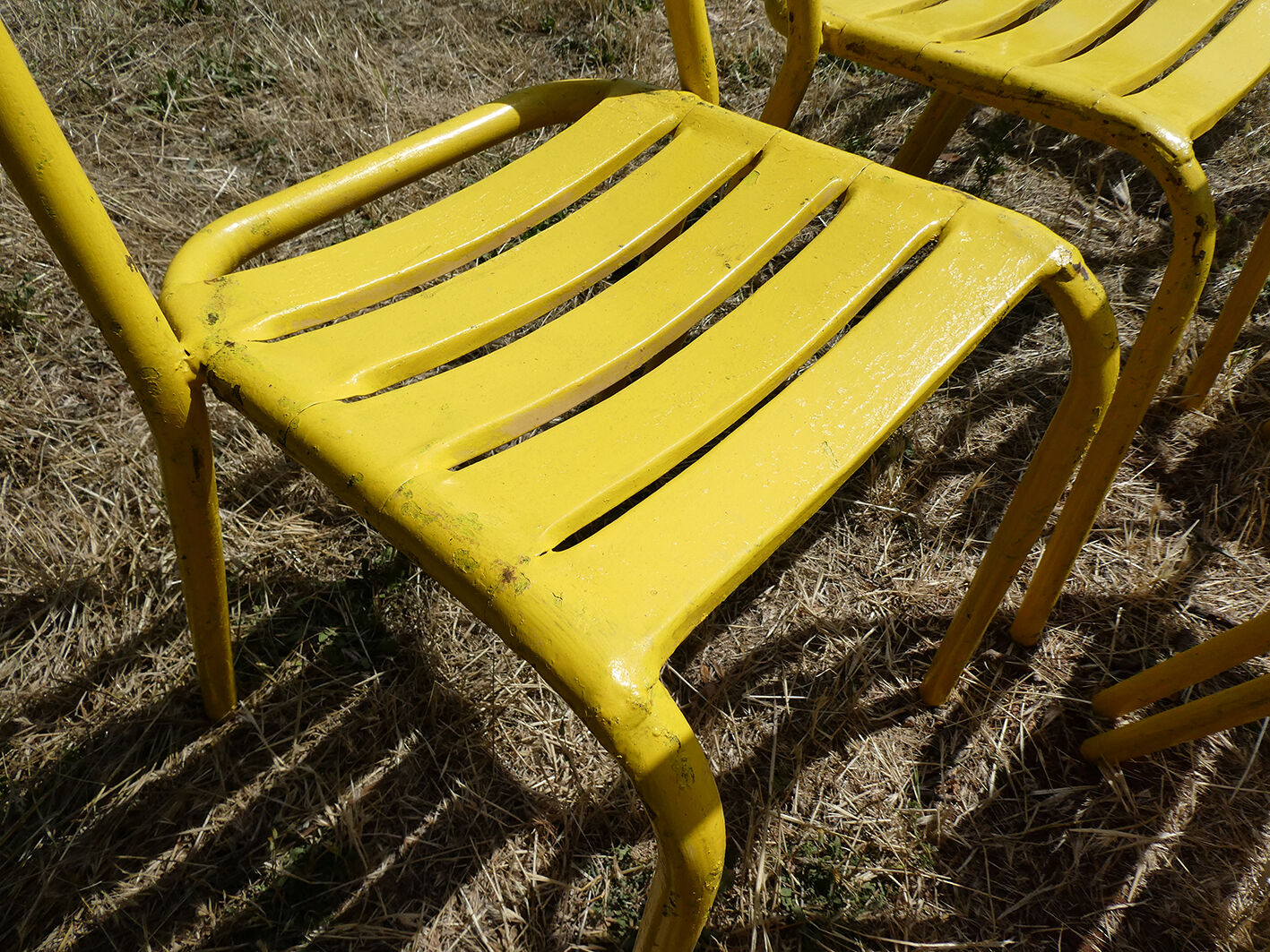 Lot of 11 yellow metallic bistro chairs from the 1950s
