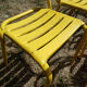 Lot of 11 yellow metallic bistro chairs from the 1950s