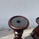 Trio of large turned wooden candlesticks