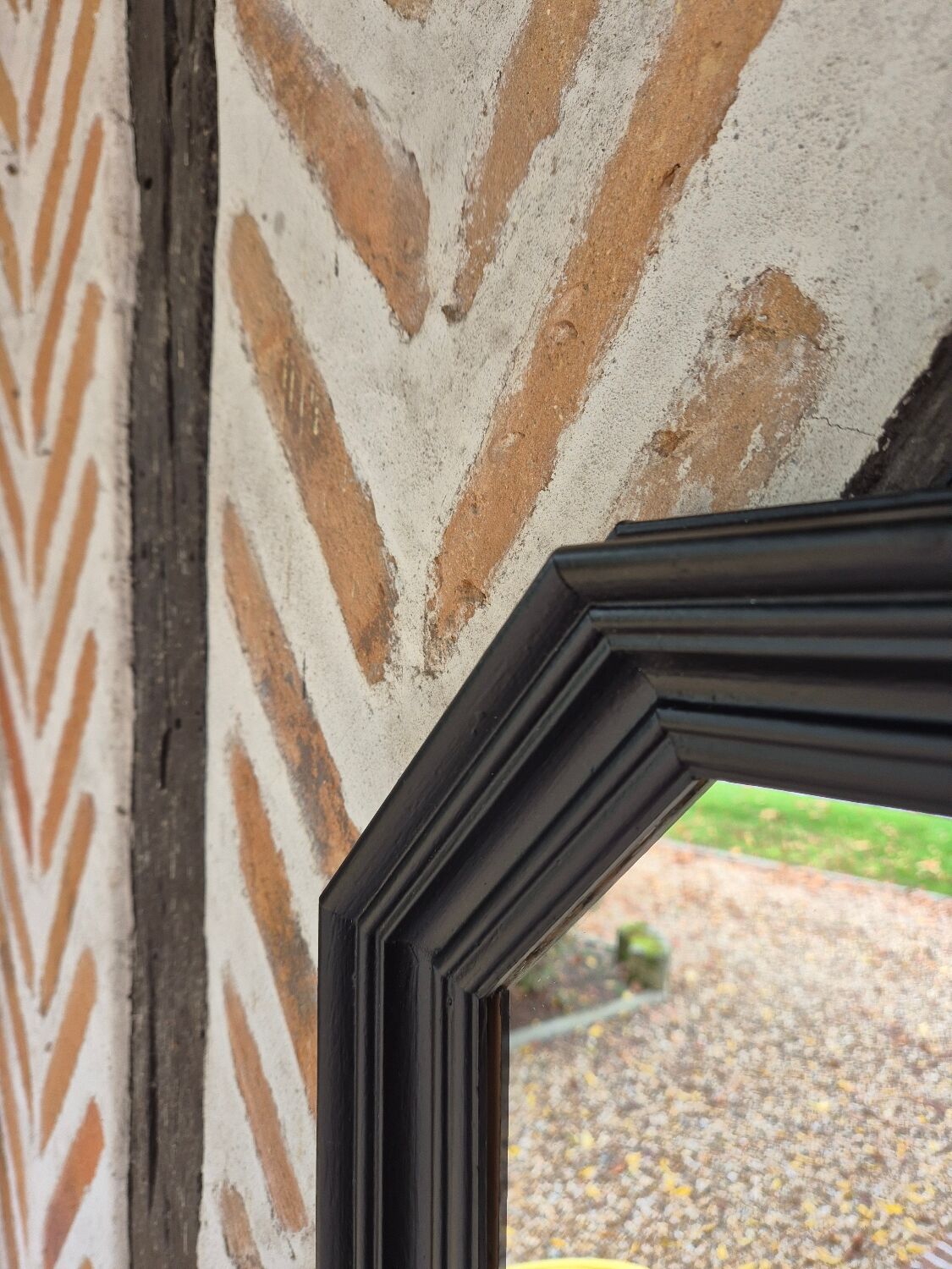 Octagonal black wood mirror