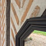 Octagonal black wood mirror