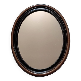 Large vintage oval wall mirror in wood-style plastic