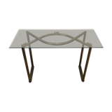Console en acier brossé et laiton et plateau formé d'une dalle de verre. Travail français. Vers 1970