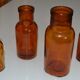 Suite de quatre vases soliflore flacons bouteilles d'apothicaire