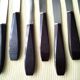 Box of 12 vintage table knives in stainless steel and brown bakelite