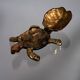 Golden brass turtle in decorative ashtray
