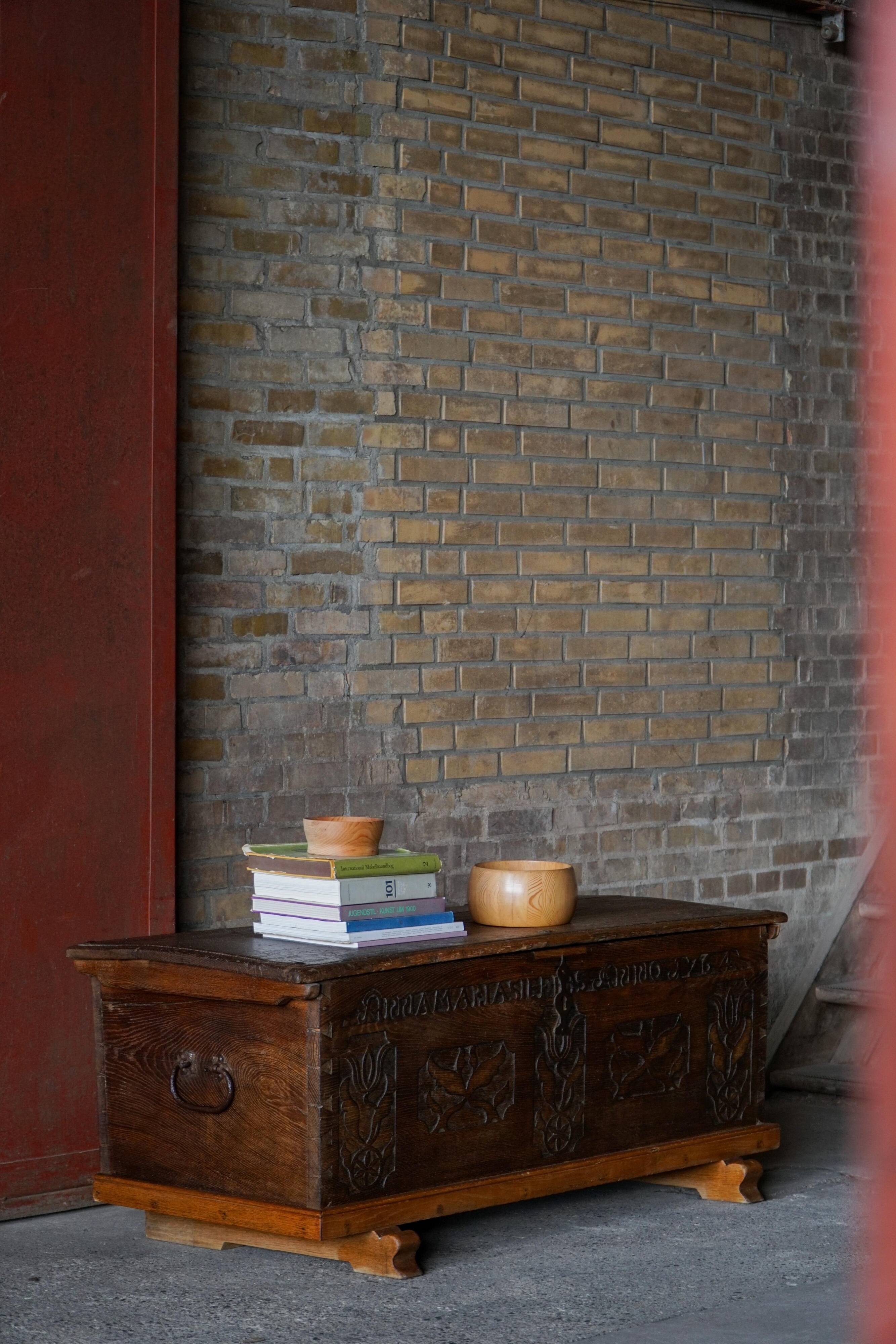 18th-century Scandinavian popular art oak chest with carved panels, dated 1764.