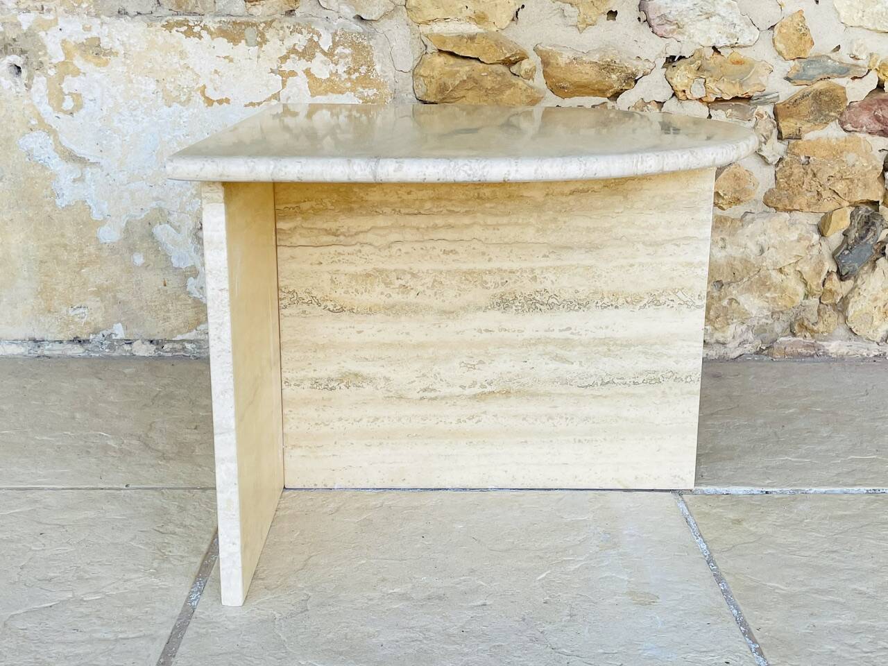 Vintage side table in travertine, circa 1980s.