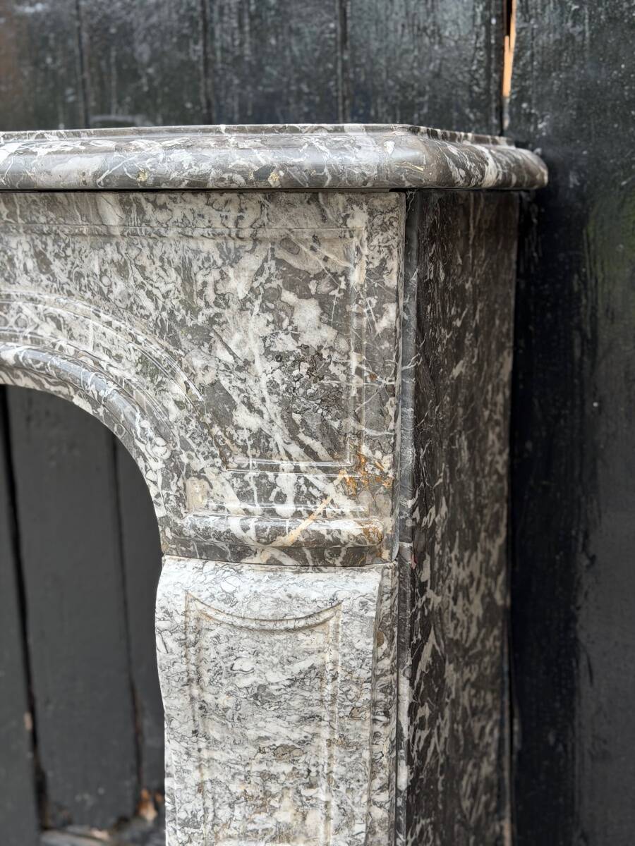 Louis XV fireplace in grey Saint Anne marble, 18th century.