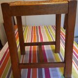 Oak stool seated in straw