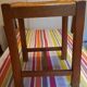 Oak stool seated in straw