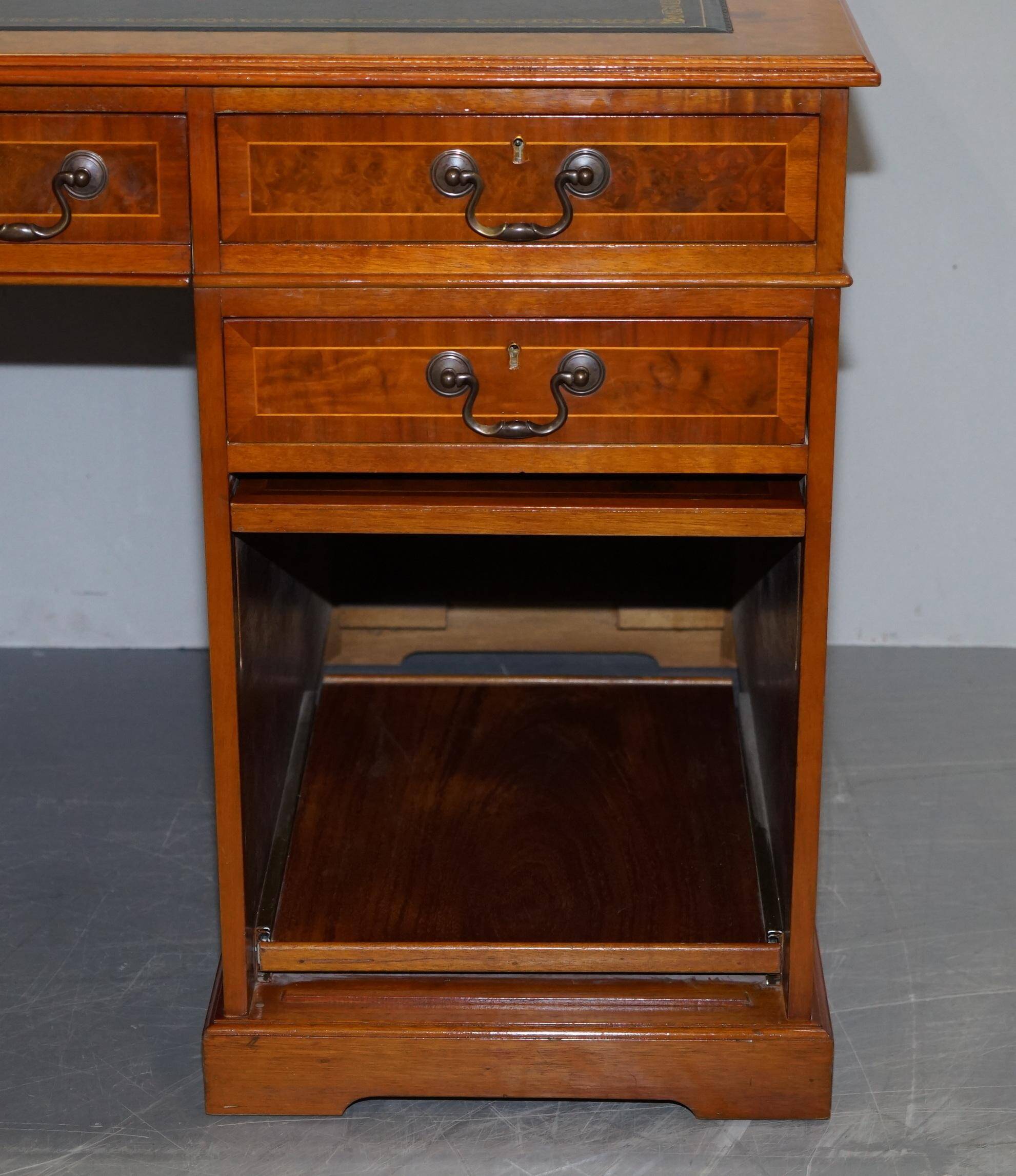 Partner desk in burr walnut designed to conceal computer equipment.