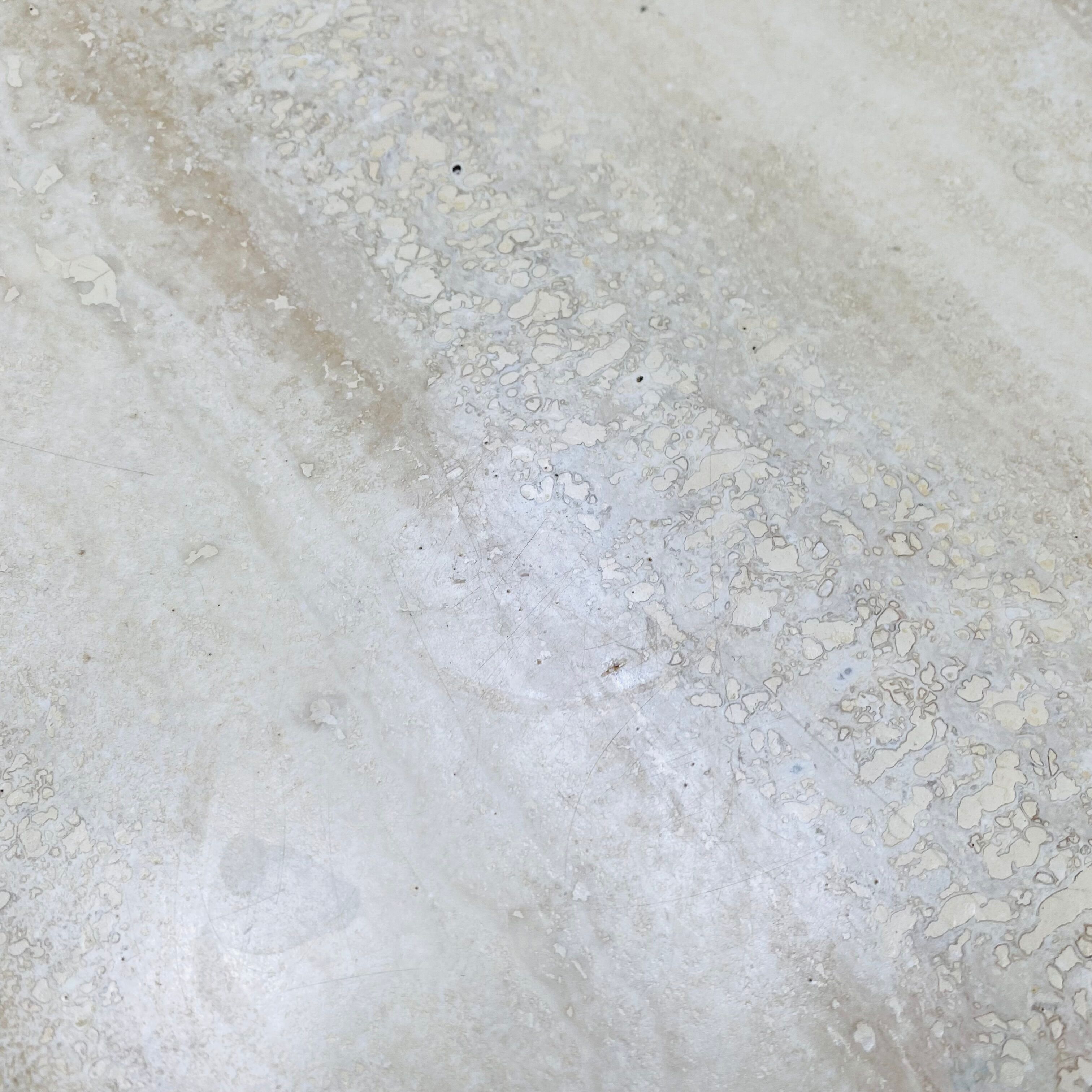 Travertine eye coffee table Roche Bobois
