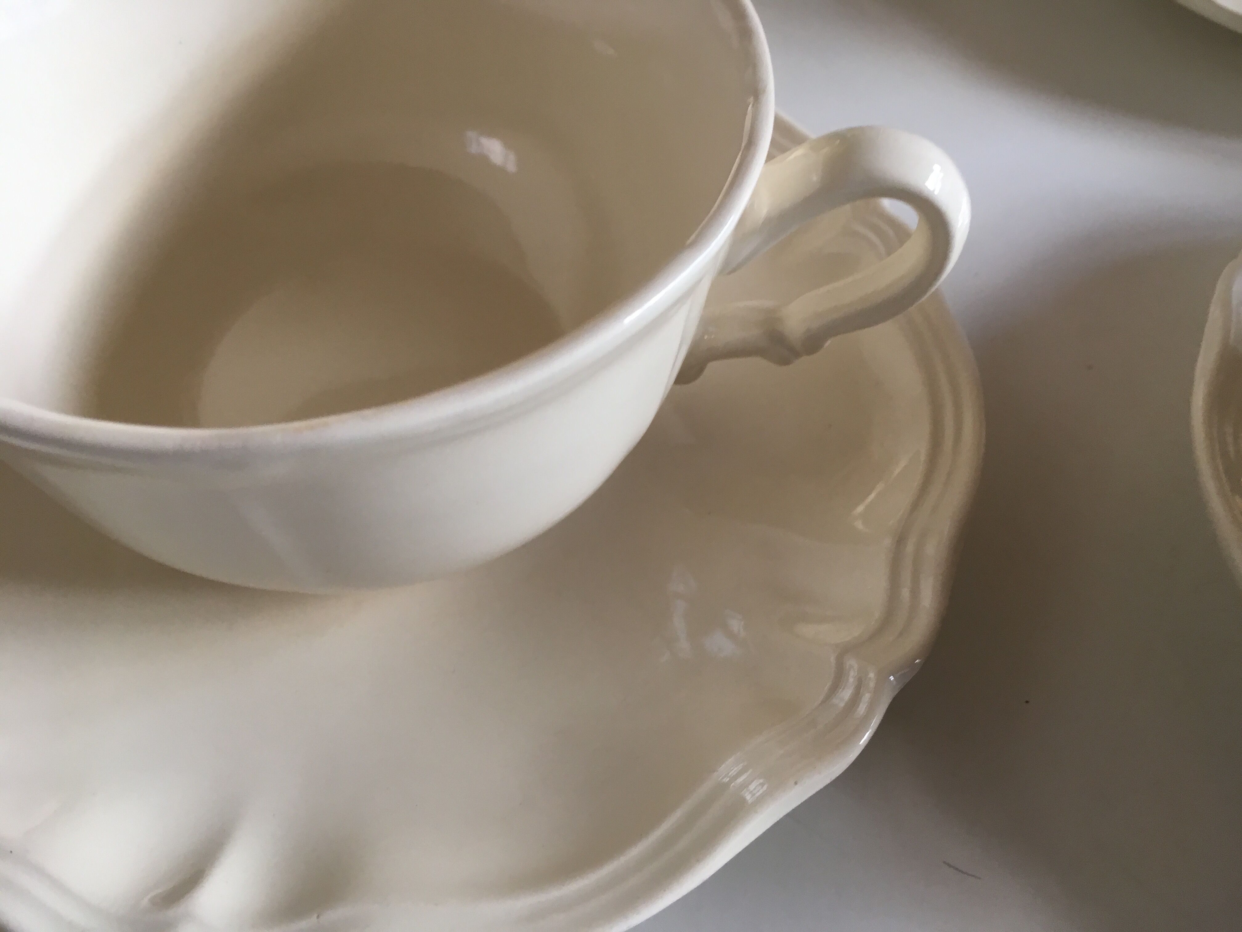 Set of 4 cups breakfasts in faience Sarreguemines ivory to godrons