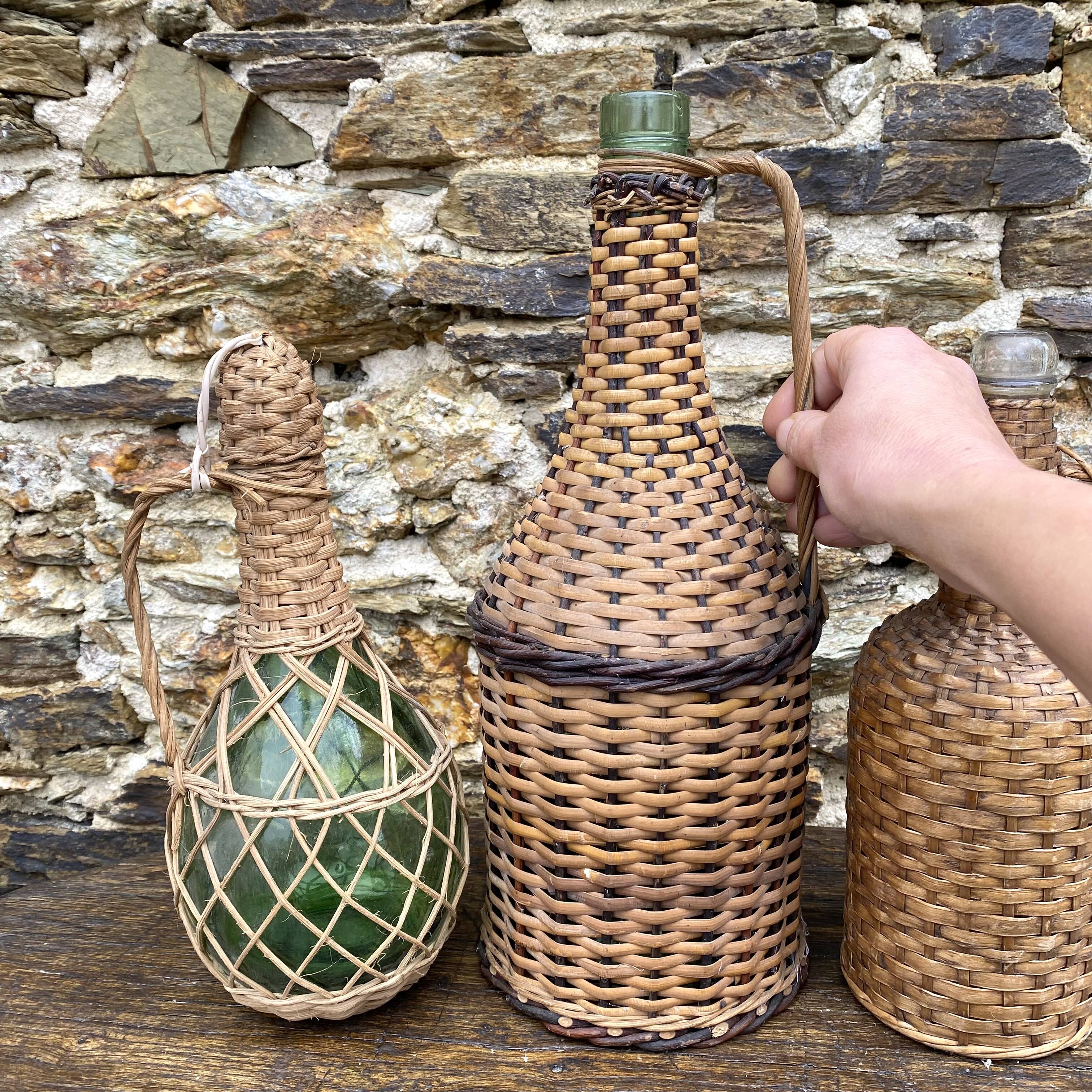 Glass bottles and rattan, woven wicker