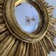 Vintage 1960s sunburst witch's eye mirror in gold - 27 cm