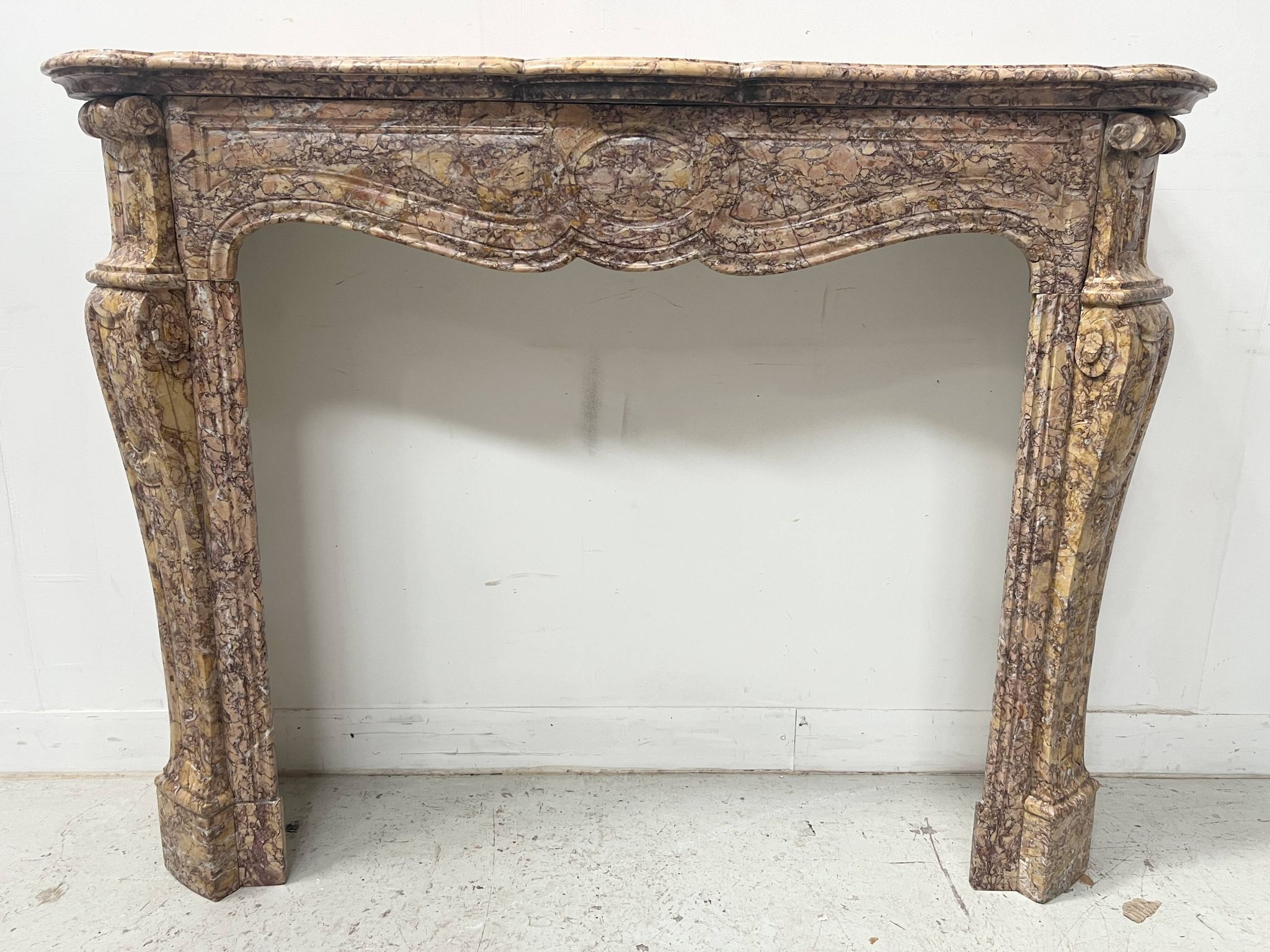 Louis XV style fireplace, Pompadour model, speckled breccia marble, 19th century