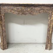 Louis XV style fireplace, Pompadour model, speckled breccia marble, 19th century