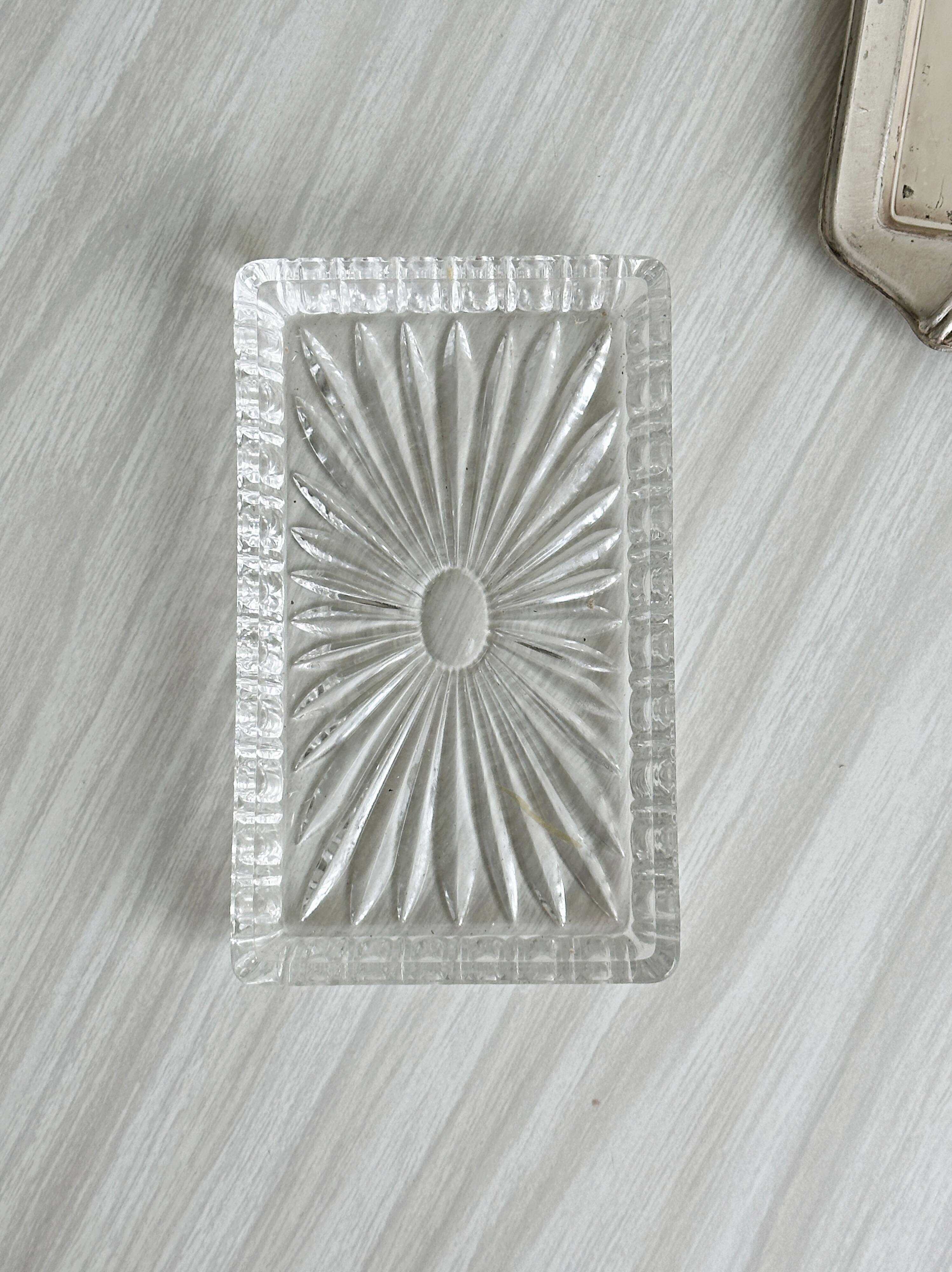 Metal butter dish and thick rectangular glass bowl.