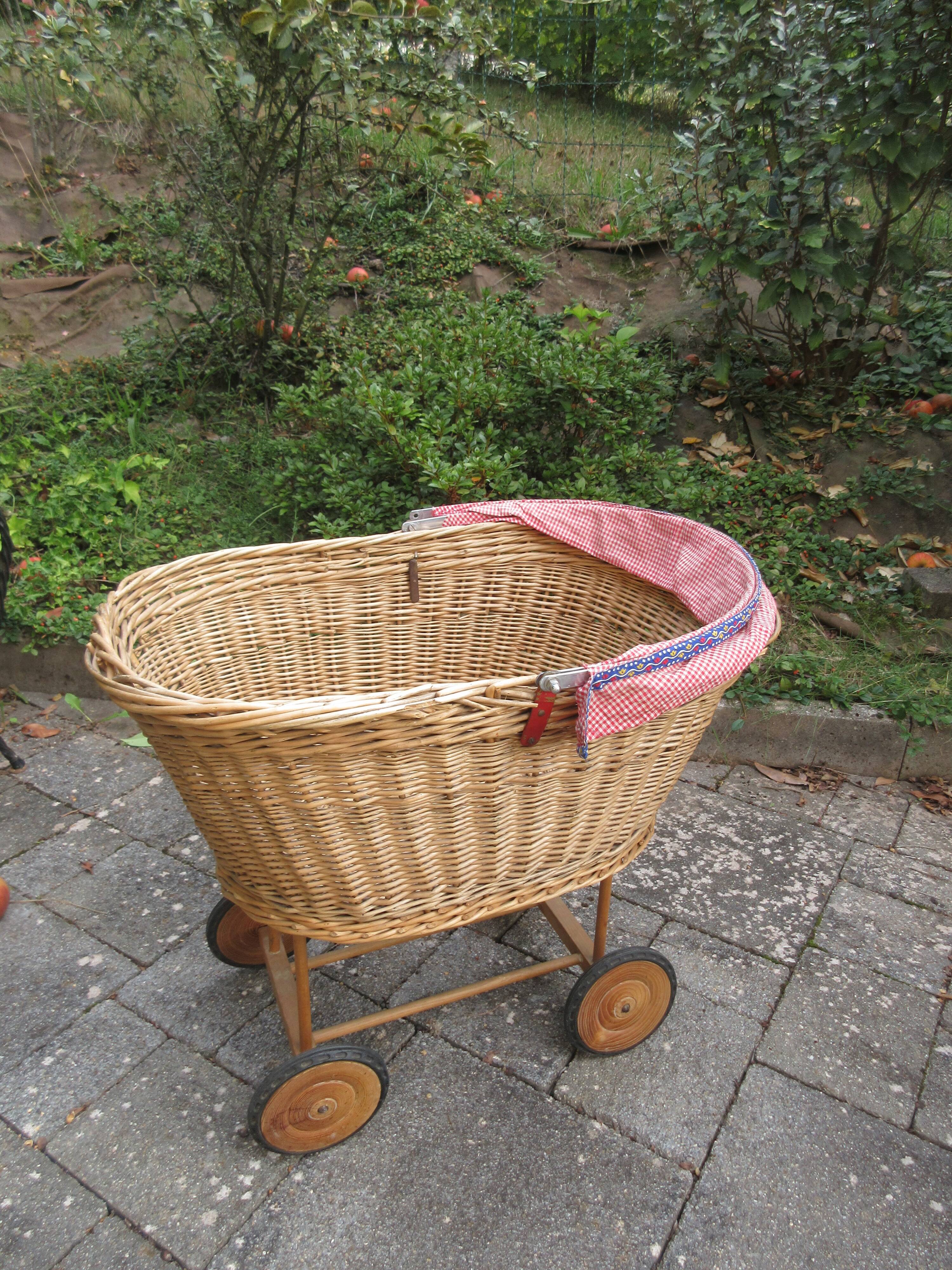Doll cradle on wicker wheels