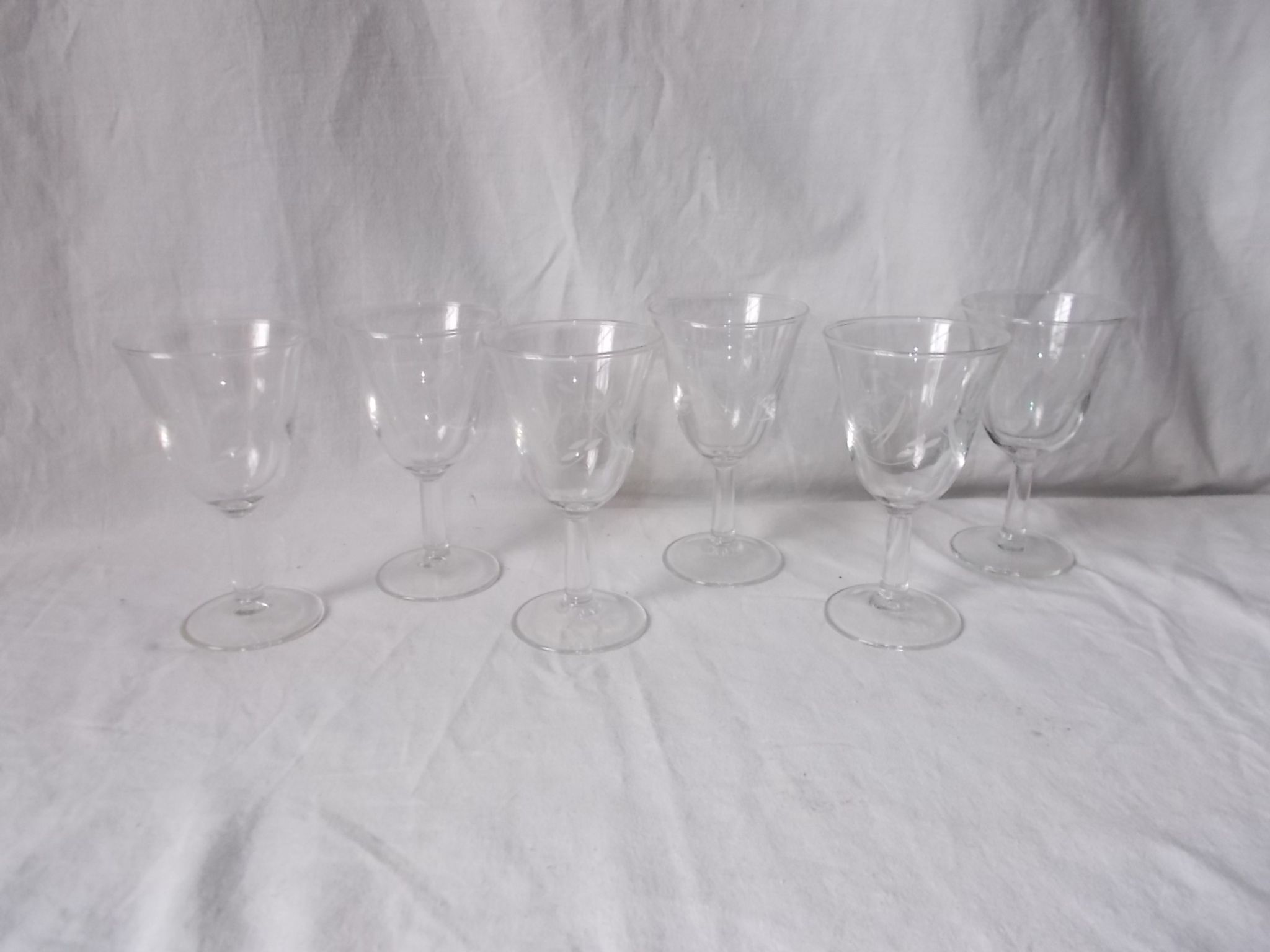 Set of 6 antique decorated wine glasses.