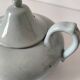 Celadon speckled glazed ceramic teapot