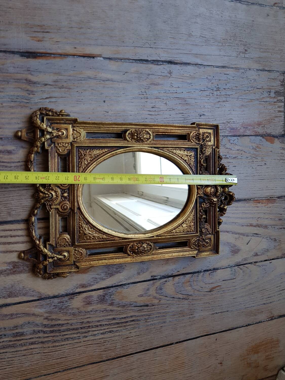 Old small golden mirror