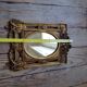 Old small golden mirror