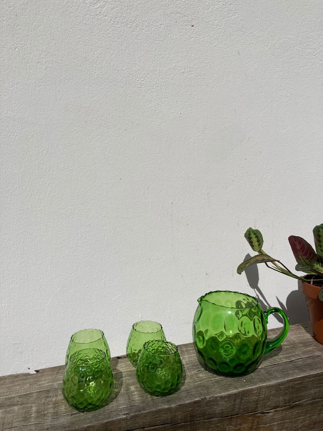 4 green water glasses and vintage blown glass carafe