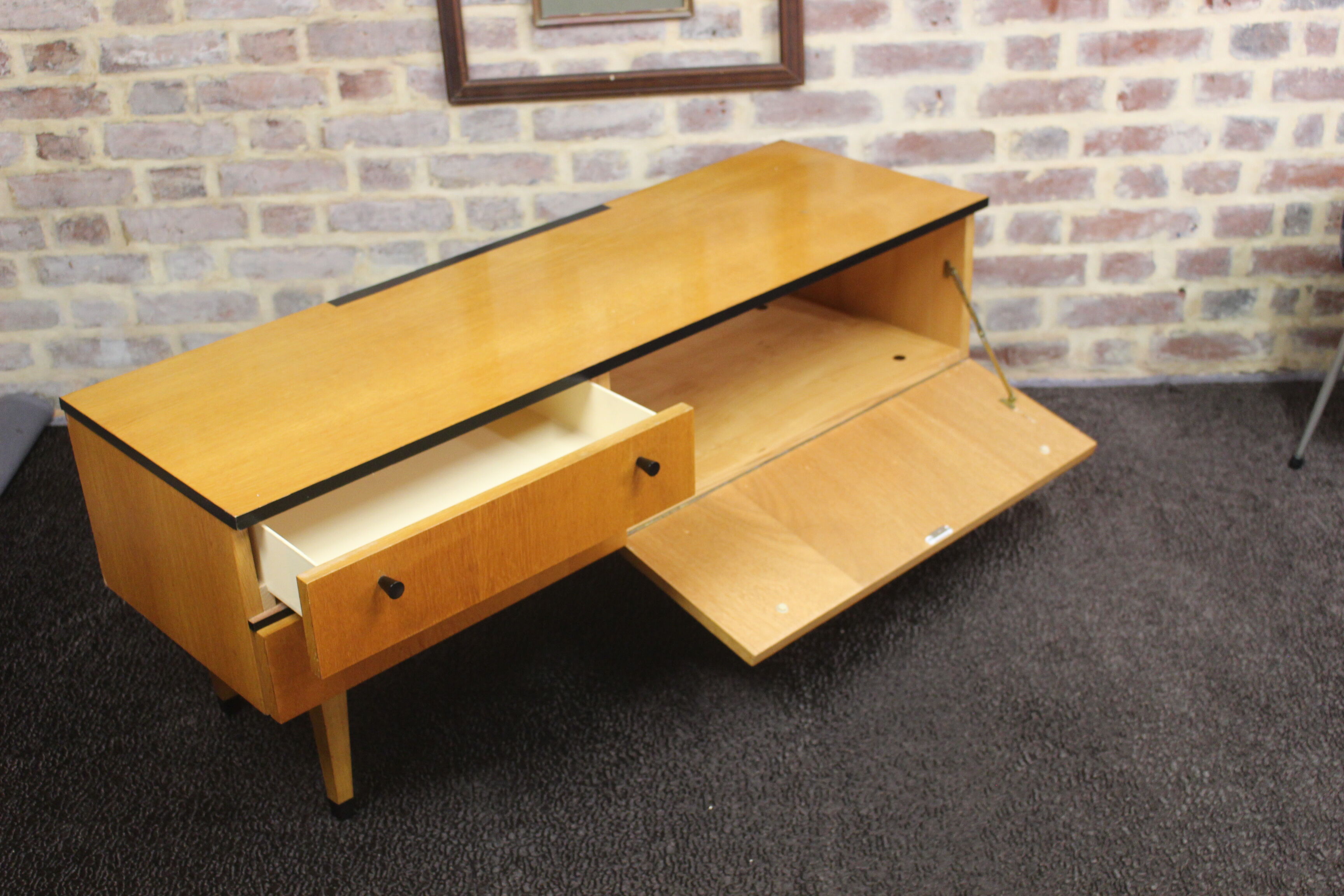 Black-gloved 50s varnished wooden sideboard