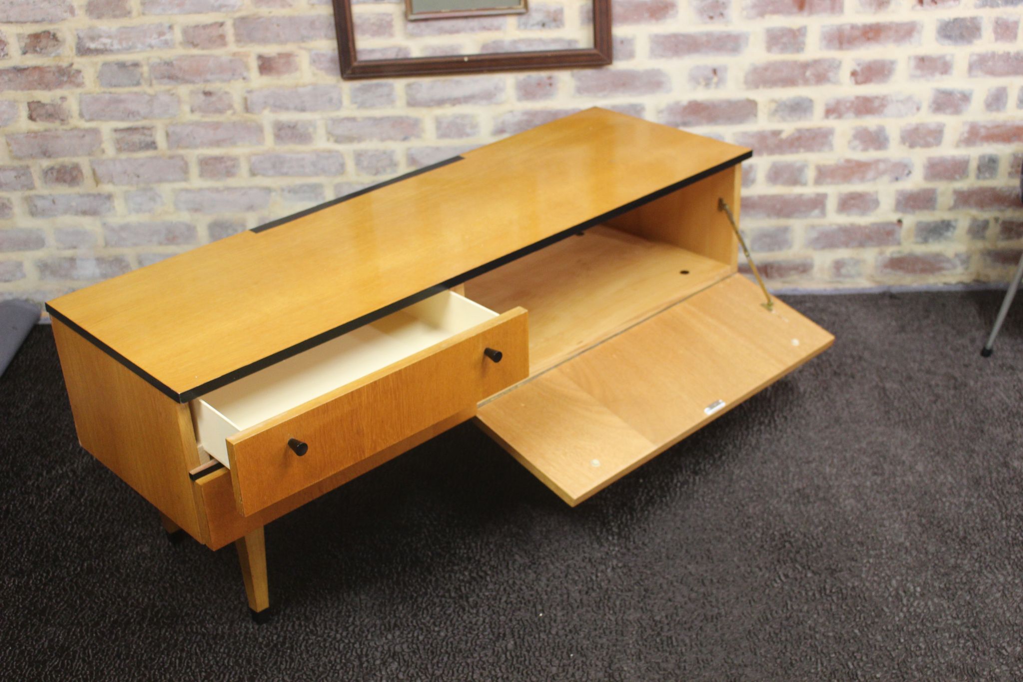 Black-gloved 50s varnished wooden sideboard