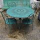 Salon de jardin vert fer forgé table deux chaises et deux fauteuils