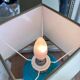 Elegant turquoise crackled ceramic ball lamp, on a br base