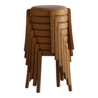 Modern Swedish, set of 14 stackable stools in birch and hessian fabric, 1980s.