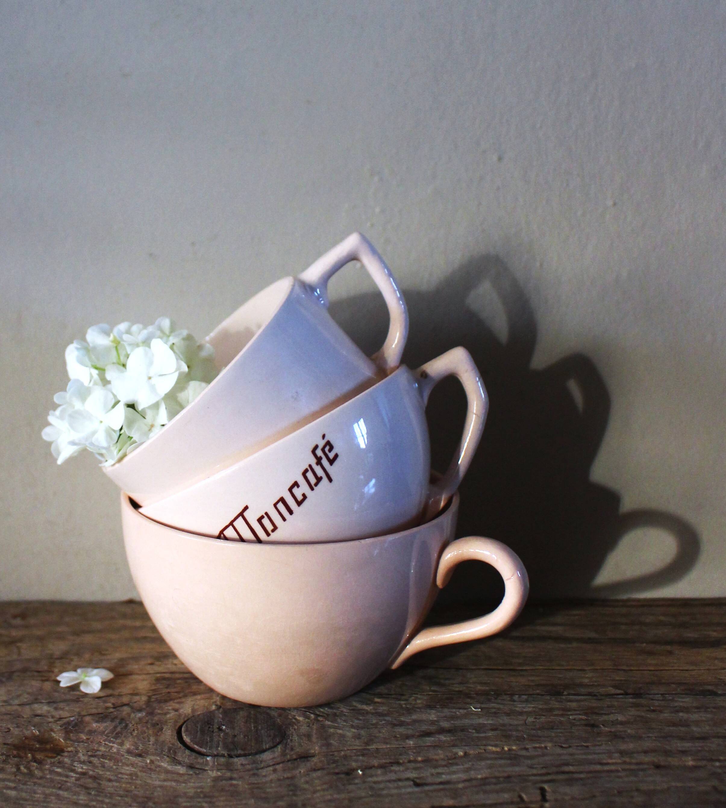 A set of 3 pink earthenware cups from Digoin Sarreguemines.
