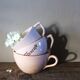 A set of 3 pink earthenware cups from Digoin Sarreguemines.