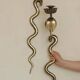 Pair of Neo-Egyptian Style Engraved Brass Wall Sconces Featuring Cobras
