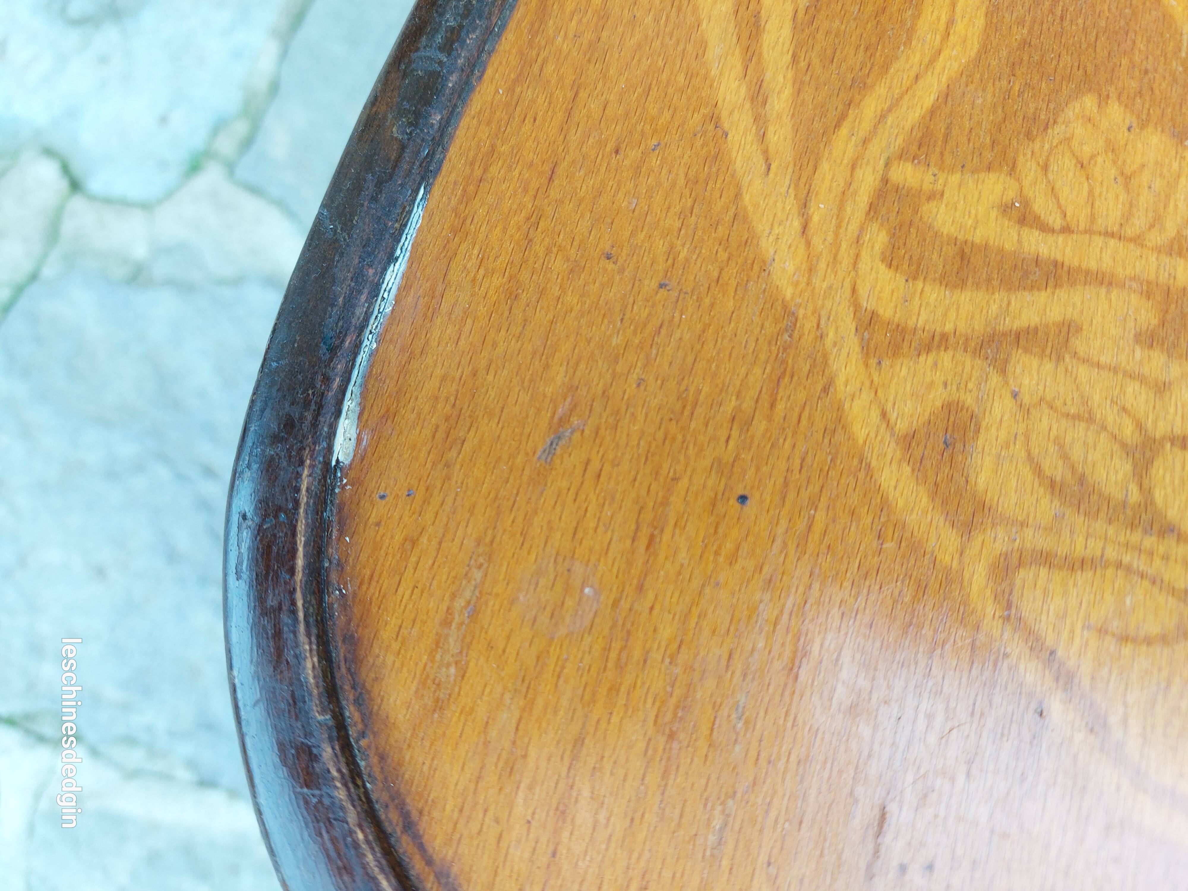 4 bentwood bistro chairs with a pattern on the seat