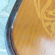 4 bentwood bistro chairs with a pattern on the seat