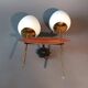 Applique à deux lumières en teck, laiton doré et opaline blanche Maison Lunel 1960.