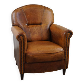 Charming and rugged sheepskin leather armchair, large model