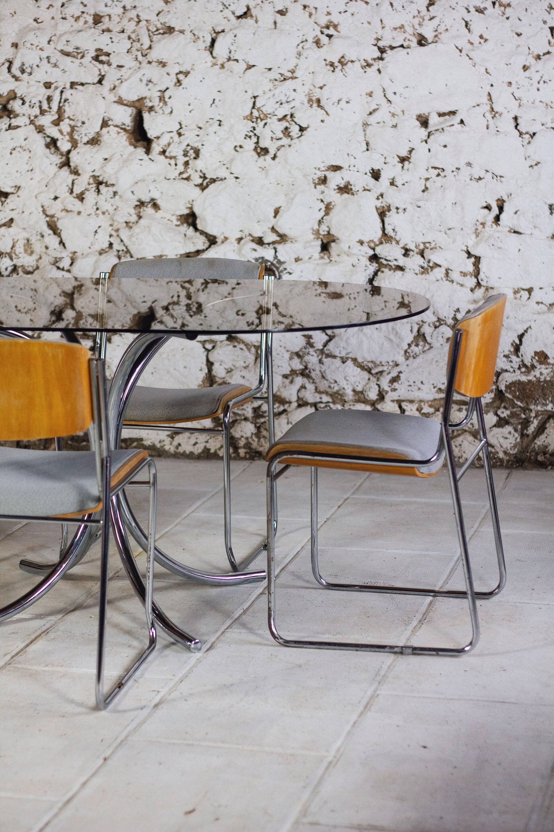 Oval dining table in chrome and smoked glass, 1970.
