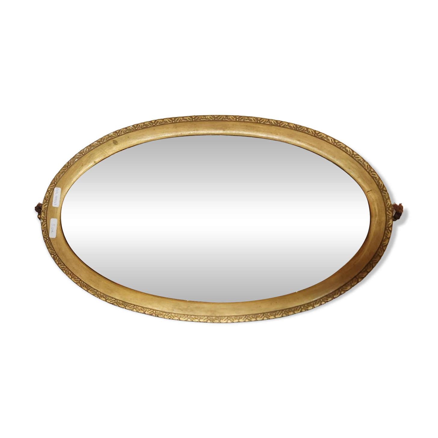 Antique oval mirror with a gilded frame, bevelled glass.