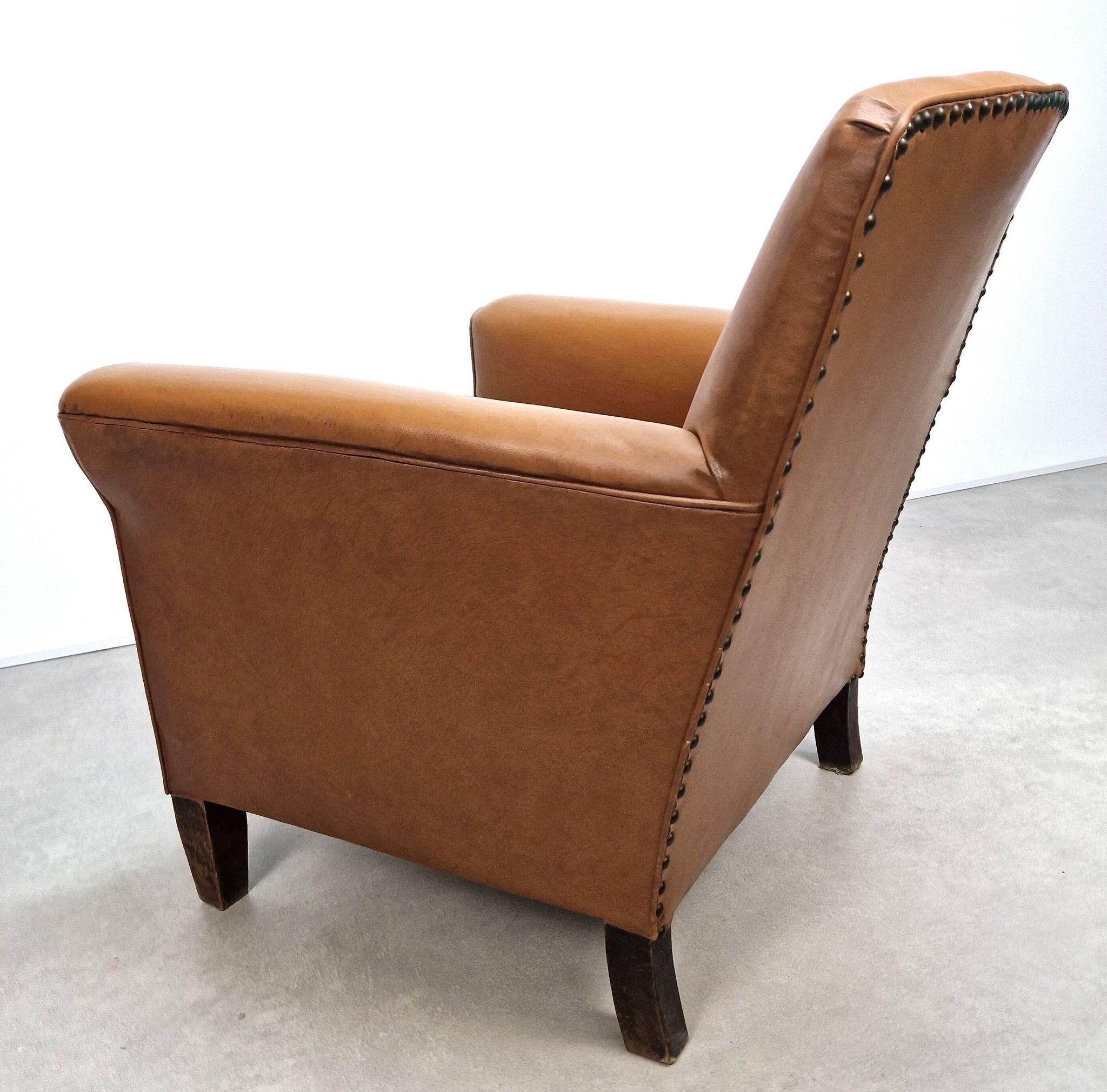 50s club chair in imitation leather and wood